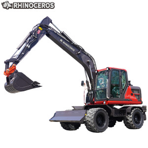 Excavatrice sur roues avec grappin à grumes